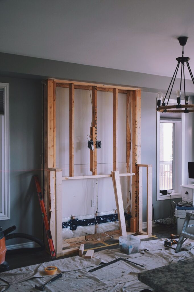 Framing of a new fireplace in a living room of a home